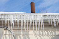 Icicles hanging from gutter along roof line
